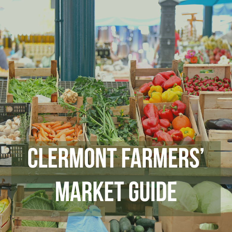 Farm stand with baskets of produce with text "Clermont Farmers' Market Guide"