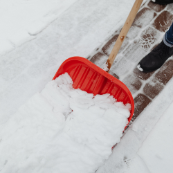 De-Icing Alternatives - shoveling snow from pathway